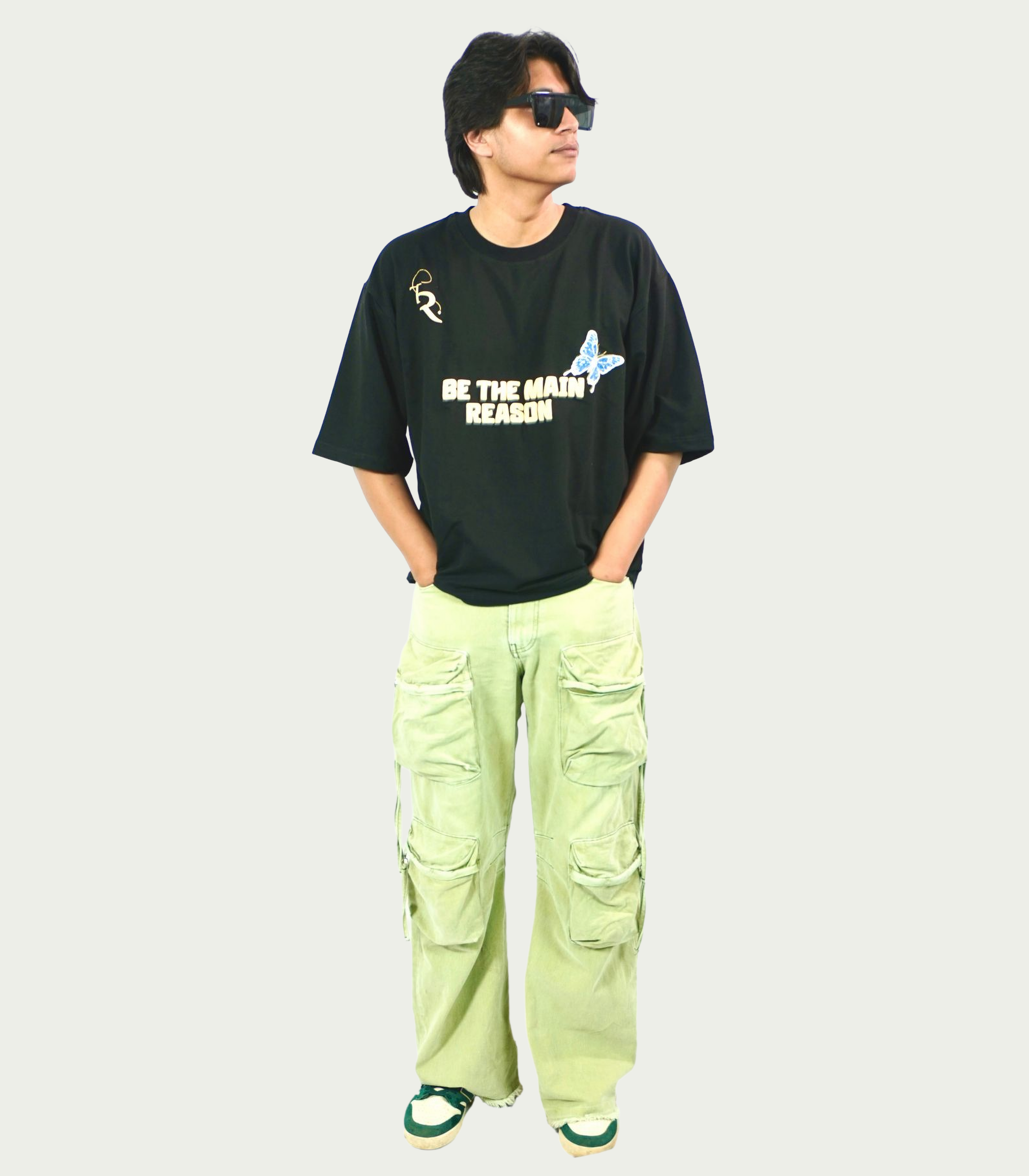 TAMRAT black boxy fit t-shirt with graphic print worn with light green cargo pants